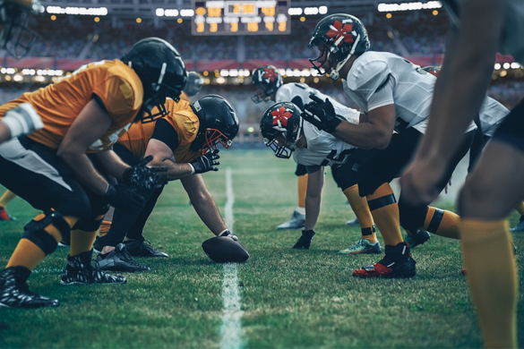 football teams face each other on the field