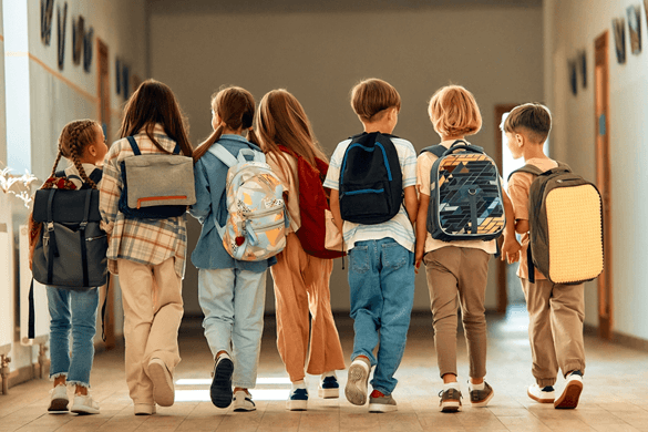 a group of school children with backpacks